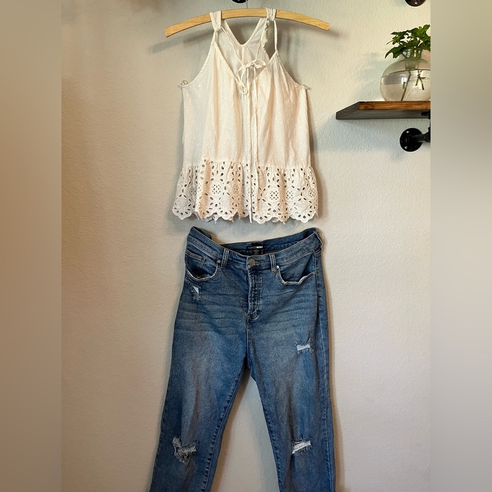 White halter style top with patterned eyelets.